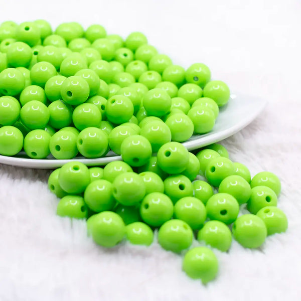 front view of a pile of 12mm Lawn Green Solid Bubblegum Beads