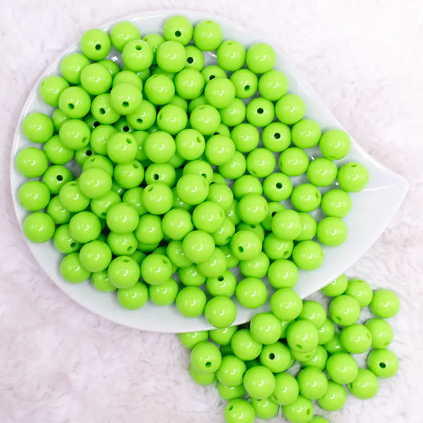 top view of a pile of 12mm Lawn Green Solid Bubblegum Beads