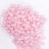 top view of a pile of 12mm Pink Crackle AB Bubblegum Beads