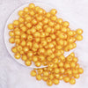 top view of a pile of 12mm Mustard Yellow Transparent Bead in a Bead Bubblegum Beads