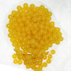 top view of a pile of 12mm Mustard Jelly Acrylic Bubblegum Beads - 20 Count