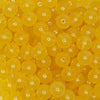 close up view of a pile of 12mm Mustard Jelly Acrylic Bubblegum Beads - 20 Count