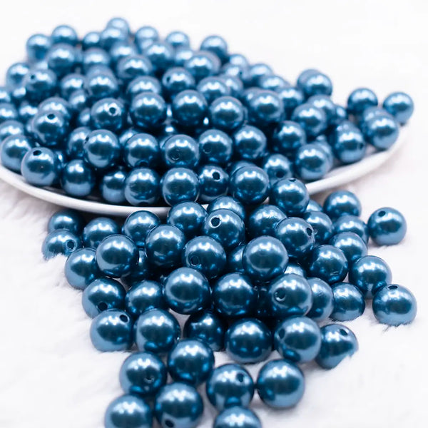 front view of a pile of 12mm Navy Blue Pearl Acrylic Bubblegum Beads - 20 Count