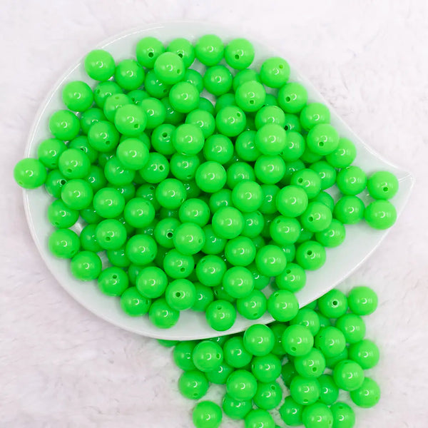 top view of a pile of 12mm Neon Green Solid Bubblegum Beads