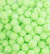 close up view of a pile of 12mm Neon Lime Green Rhinestone AB Bubblegum Beads - 10 & 20 Count