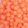 close up view of a pile of 12mm Neon Orange Rhinestone AB Bubblegum Beads - 10 & 20 Count