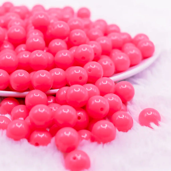 front view of a pile of 12mm Neon Pink Acrylic Bubblegum Beads