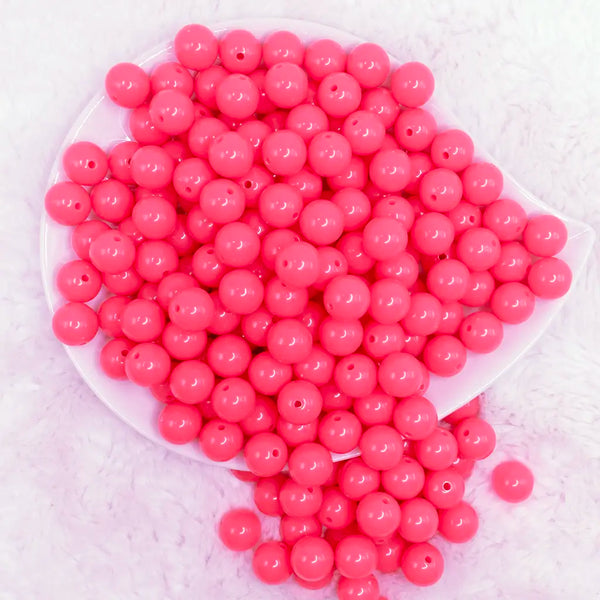 top view of a pile of 12mm Neon Pink Acrylic Bubblegum Beads