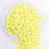top view of a pile of 12mm Neon Yellow Rhinestone AB Bubblegum Beads - 10 & 20 Count