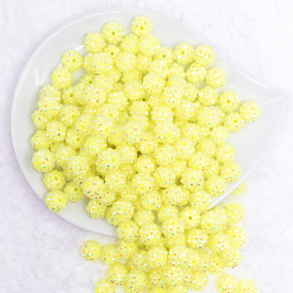 top view of a pile of 12mm Neon Yellow Rhinestone AB Bubblegum Beads - 10 & 20 Count