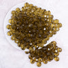 top view of a pile of 12mm Olive Green Transparent Faceted Shaped Bubblegum Beads