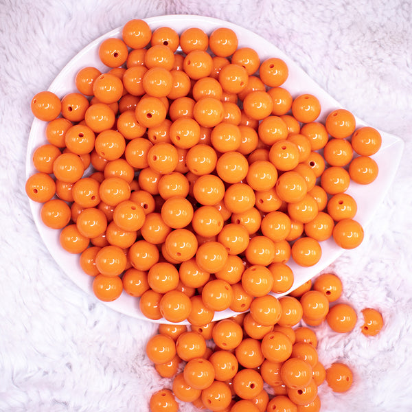 top view of a pile of 12mm Orange Acrylic Bubblegum Beads - 20 & 50 Count