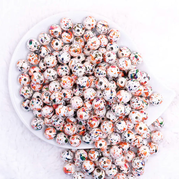 top view of a pile of 12mm Orange and Black Splatter AB Acrylic Bubblegum Beads