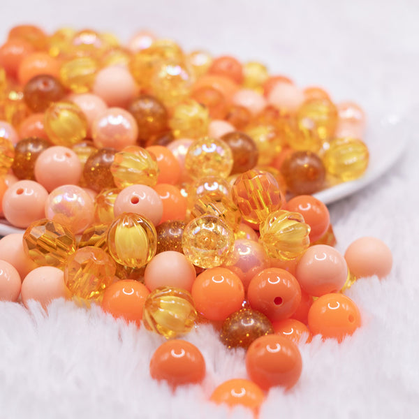 front view of a pile of 12mm Orange Acrylic Bubblegum Bead Mix