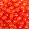 close up view of a pile of 12mm Orange Crackle Bubblegum Beads