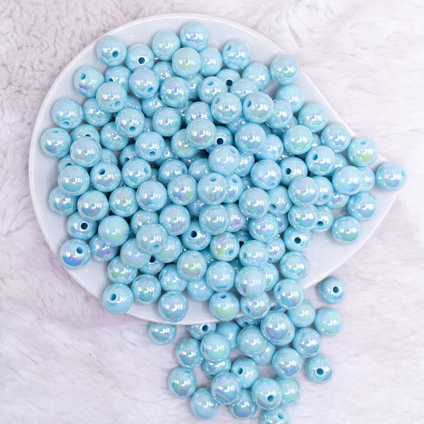 top view of a pile of 12mm Pastel Blue AB Solid Bubblegum Beads