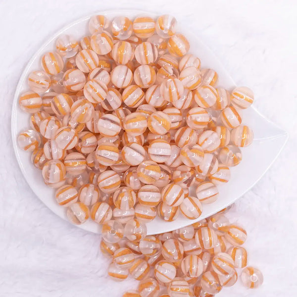 top view ofa pile of 12mm Peach Cats Eye Acrylic Bubblegum Beads - 20 Count