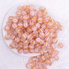 top view of a pile of 12mm Pink Cats Eye Acrylic Bubblegum Beads - 20 Count