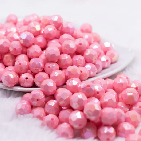 front view of a pile of 12mm Pink Opaque AB Faceted Shaped Bubblegum Beads