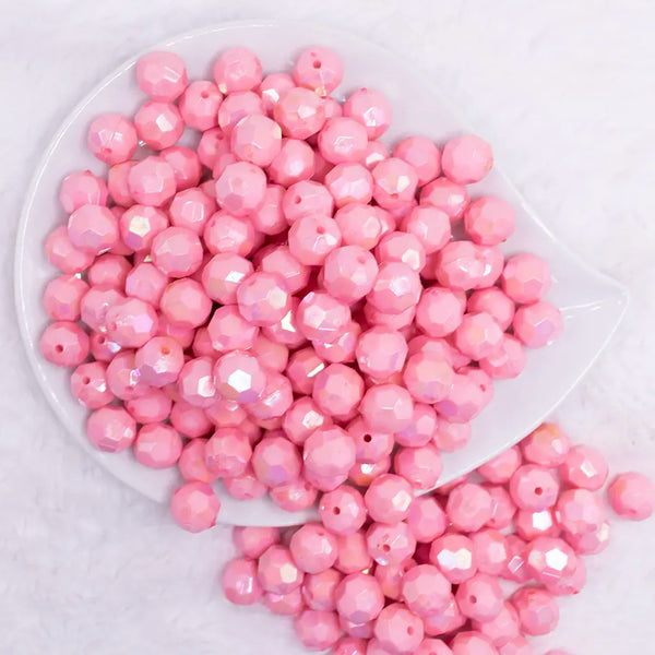 top view of a pile of 12mm Pink Opaque AB Faceted Shaped Bubblegum Beads