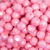 close up view of a pile of 12mm Pink Opaque AB Faceted Shaped Bubblegum Beads