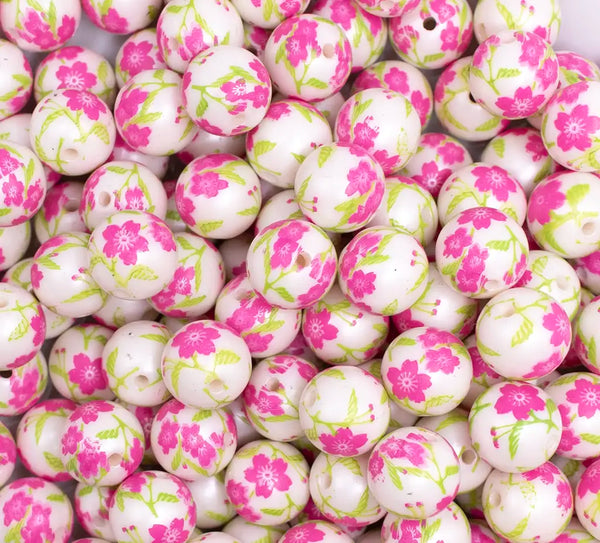 close up view of a pile of 12mm Pink and Green Floral print Bubblegum Beads