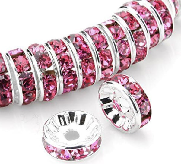 front view of a pile of 12mm Pink Rhinestone Rondelle Spacer Beads - Set of 10
