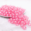 front view of a pile of 12mm Pink Transparent Pumpkin Shaped Bubblegum Beads