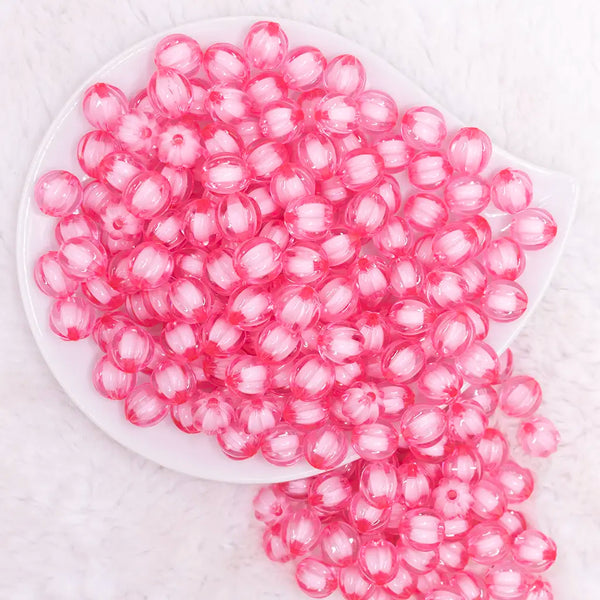 top view of a pile of 12mm Pink Transparent Pumpkin Shaped Bubblegum Beads