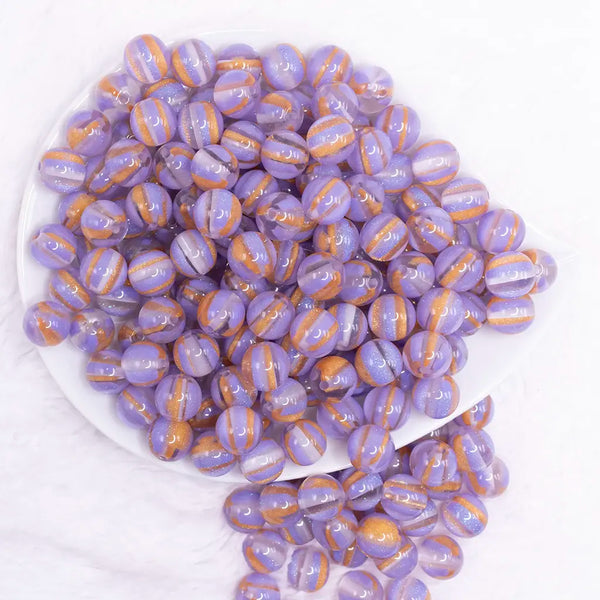 top view of a pile of 12mm Purple Cats Eye Acrylic Bubblegum Beads - 20 Count