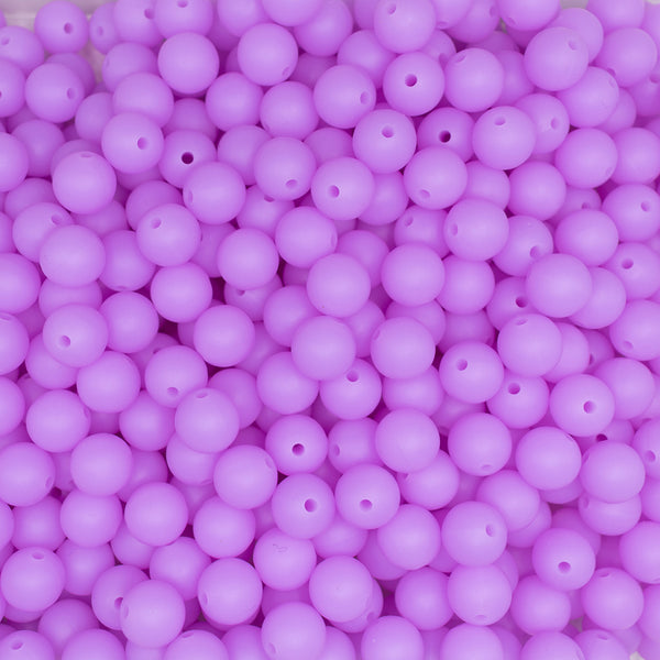 top view of a pile of 12mm Purple Glow In The Dark Silicone Bead