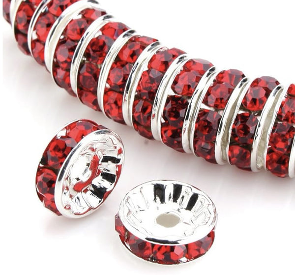 front view of a pile of 12mm Red Rhinestone Rondelle Spacer Beads - Set of 10