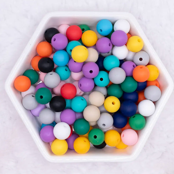 top view of a pile of 12mm Solid Color Mix Silicone Round Beads - 100 Count