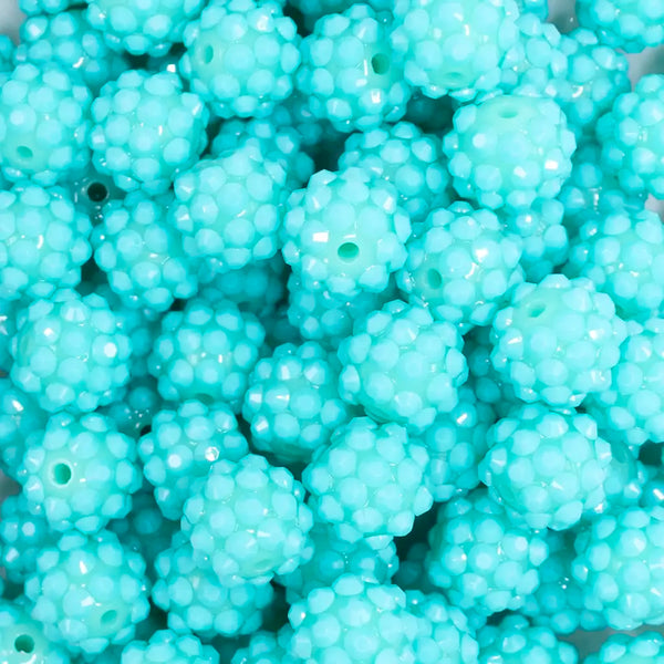 close up view of a pile of 12mm Teal on Teal Rhinestone Bubblegum Beads