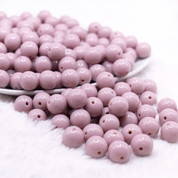 front view of a pile of 12mm Thistle Purple Passion Solid Acrylic Bubblegum Beads