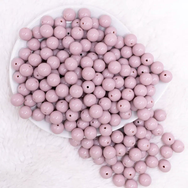 top view of a pile of 12mm Thistle Purple Passion Solid Acrylic Bubblegum Beads