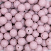 close up view of a pile of 12mm Thistle Purple Passion Solid Acrylic Bubblegum Beads