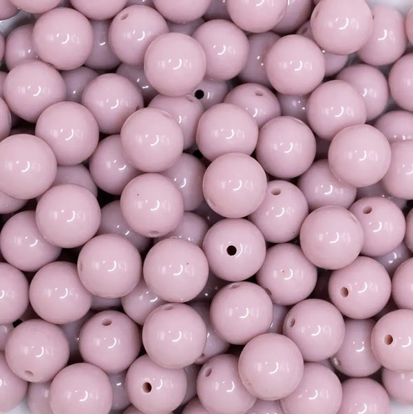 close up view of a pile of 12mm Thistle Purple Passion Solid Acrylic Bubblegum Beads