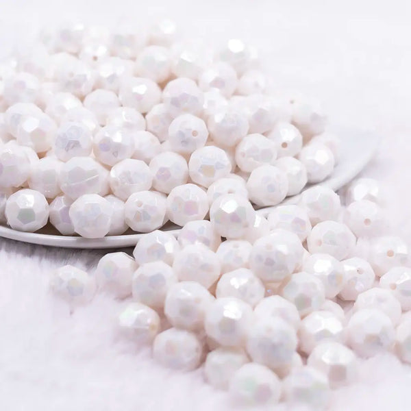 front view of a pile of 12mm White Opaque AB Faceted Shaped Bubblegum Beads