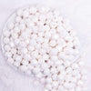 close up view of a pile of 12mm White Opaque AB Faceted Shaped Bubblegum Beads