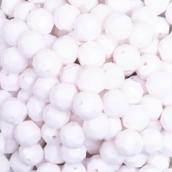 close up view of a pile of 12mm White Opaque Faceted Shaped Bubblegum Beads