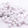 front view of a pile of 12mm White Opaque Faceted Shaped Bubblegum Beads