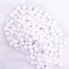 top view of a pile of 12mm White Opaque Faceted Shaped Bubblegum Beads