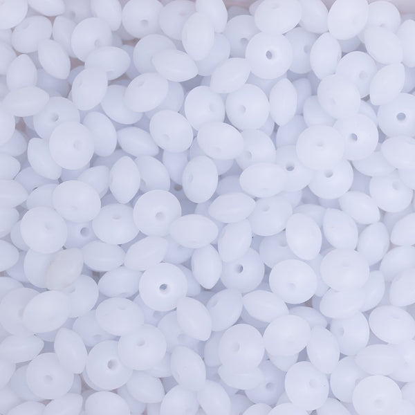 top view of a pile of 12mm White Glow in The Dark Lentil Silicone Bead