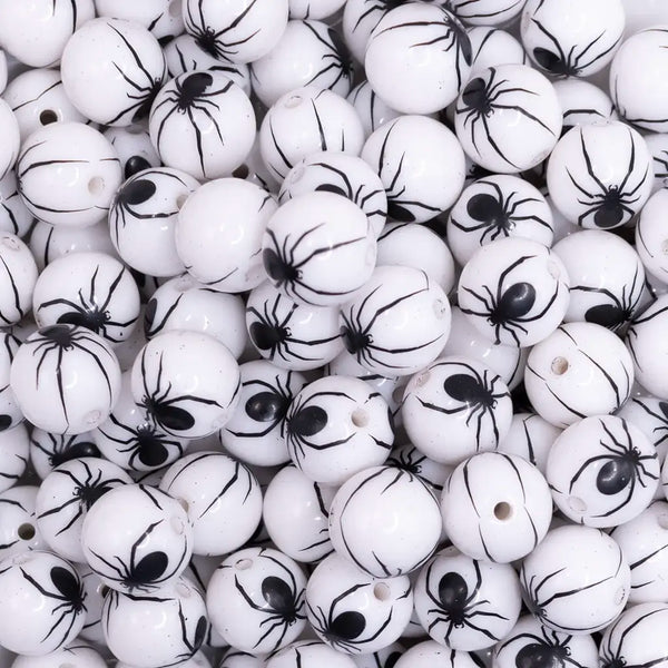 close up of a pile of 12mm White with Black Spider Print Bubblegum Beads