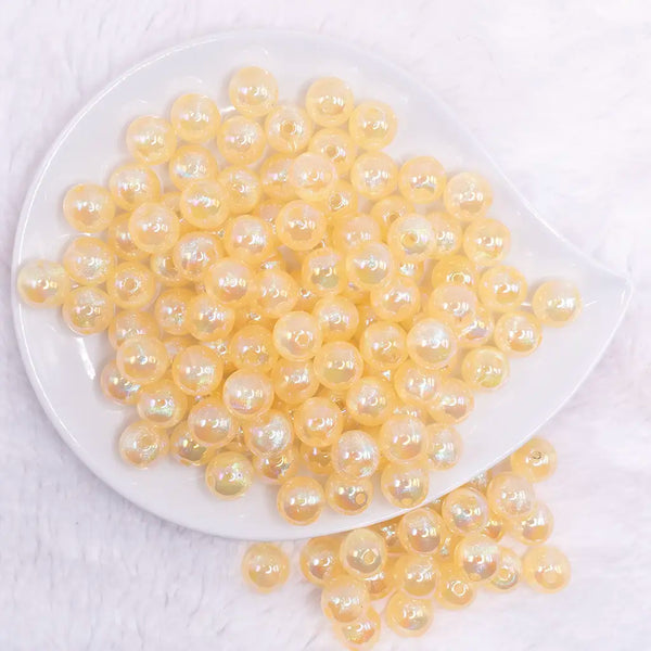 top view of a pile of 12mm Yellow Opal Bubblegum Beads - 20 Count