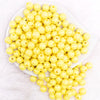 top view of a pile of 12mm Yellow AB Solid Acrylic Bubblegum Beads