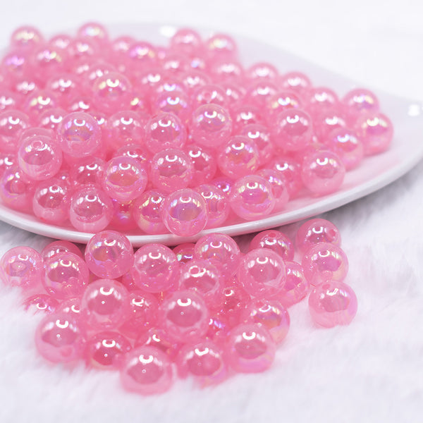 front view of a pile of 12mm Bright Pink Jelly AB Acrylic Bubblegum Beads - 20 Count