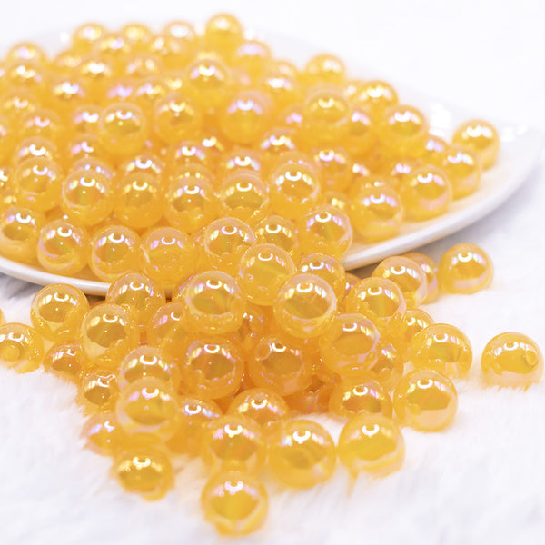 front view of a pile of 12mm Mustard Jelly AB Acrylic Bubblegum Beads - 20 Count