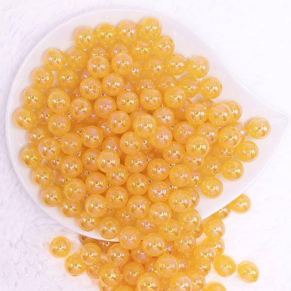 top view of a pile of 12mm Mustard Jelly AB Acrylic Bubblegum Beads - 20 Count